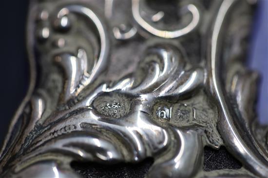 A pair of Edwardian repousse silver mounted photograph frames, by Goldsmiths & Silversmiths Co Ltd,